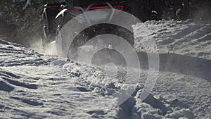 Race on ATVs Through the Snowy Forest.