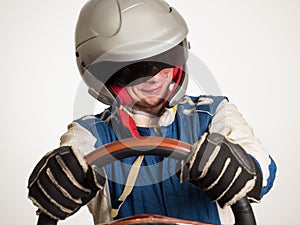 Race car driver in the helmet while driving. On a white background