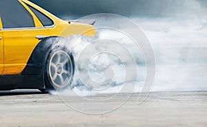 Race drift car burning tires on speed track