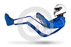 Race driver in blue white motorsport overall hover over ground in driving seat position with shoes gloves and safety crash helmet