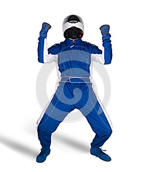 Race driver in blue white motorsport overall shoes gloves and safety gear crash helmet celebrating after winning isolated white