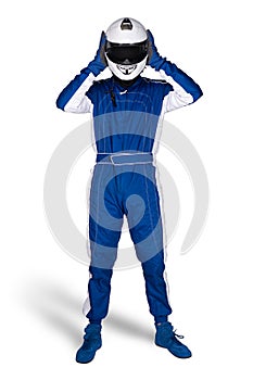 Race driver in blue white motorsport overall shoes gloves and safety gear take off crash helmet after finish isolated white