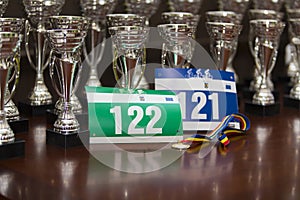 Race numbers, participation medal, and awards 
