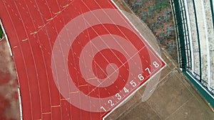 Race track or athletics track start line with lane numbers in stadium Top view Drone shot high angle view.