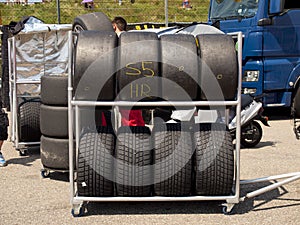 Race tyres are stalled behind the pitlane during a race