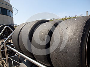 Race tyres are stalled behind the pitlane during a race