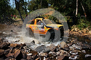 Racer off road at terrain racing car competition