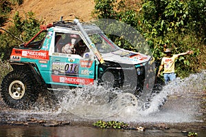 Racer off road at terrain racing car competition