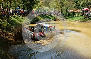 Racer offroad at terrain racing car competition