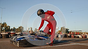 Racer starts the kart engine before the race