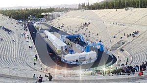 Races passing the finish line at the Athens Authentically Marathon on Panathenaic Stadium