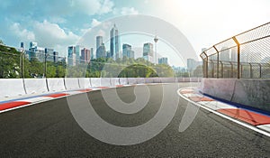 Racetrack with railing and city background