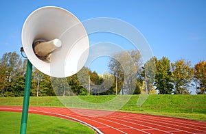 Racetrack for runners, with speaker photo