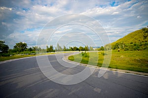 Racetrack straight, road to the mountain with the clear sky.