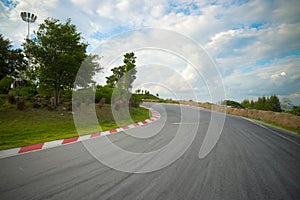 Racetrack straight, road to the mountain with the clear sky.