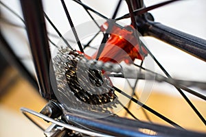 Racing bicycle red rear axle with racing cassette gears