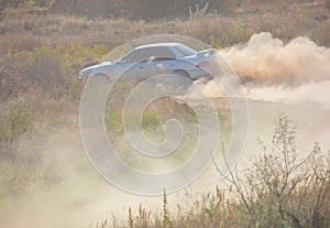 Racing Car and a lot of Dust on a Sharp Turn