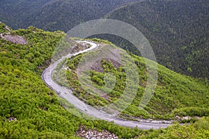 Racing cars on a mountain road