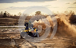 Racing in the sand on a four-wheel drive quad