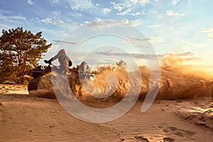 Racing in the sand on a four-wheel drive quad