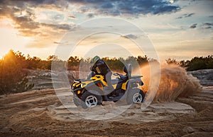 Racing in the sand on a four-wheel drive quad