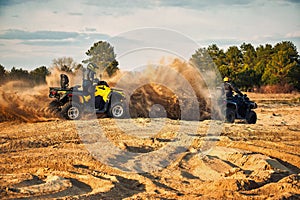 Racing in the sand on a four-wheel drive quad