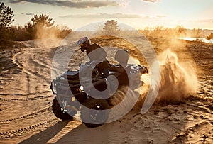 Racing in the sand on a four-wheel drive quad