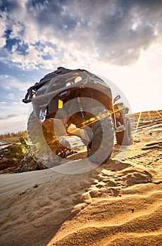 Racing in the sand on a four-wheel drive quad