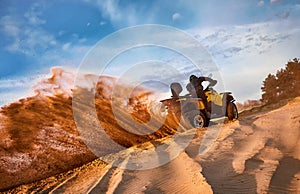 Racing in the sand on a four-wheel drive quad