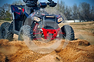 Racing in the sand on a four-wheel drive quad