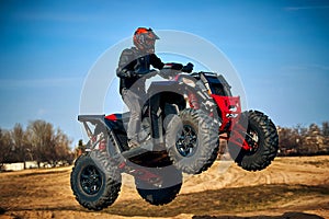 Racing in the sand on a four-wheel drive quad
