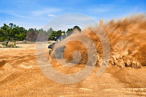 Racing in the sand on a four-wheel drive quad