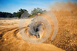 Racing in the sand on a four-wheel drive quad