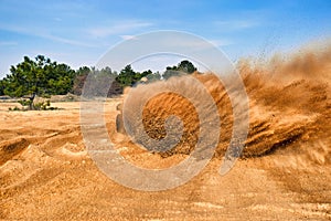 Racing in the sand on a four-wheel drive quad