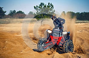 Racing in the sand on a four-wheel drive quad