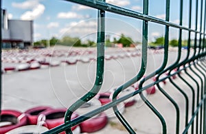 Racing track for go-karts with dividing lines made of painted and white car tires