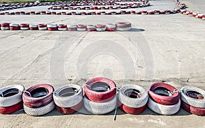 Racing track for go-karts with dividing lines made of painted and white car tires