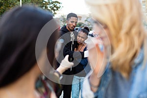 Racism - black couple being bullied