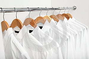 Rack with clean clothes after dry-cleaning