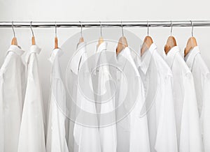 Rack with clean clothes after dry-cleaning