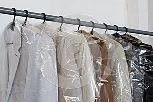 Rack with clean coats after dry cleaning on a dry cleaner