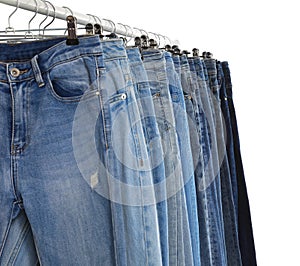 Rack with different jeans isolated