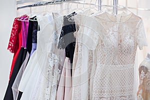 Rack with lots of beautiful dresses.