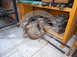 The rack of molds for blowing and shaping molten glass in glass studio photo