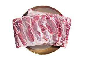 Rack of raw pork spare ribs. Isolated on white background.