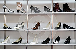 Rack of shoes in shop or department store photo