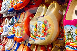 Rack in the store with rows traditional dutch wooden shoes - klompen clogs