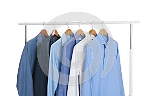 Rack with stylish men`s clothes isolated on white