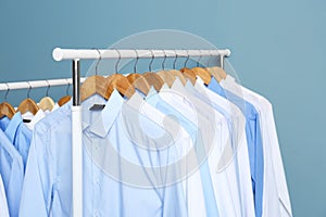 Racks with clean clothes after dry-cleaning