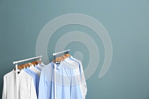 Racks with clean clothes after dry-cleaning